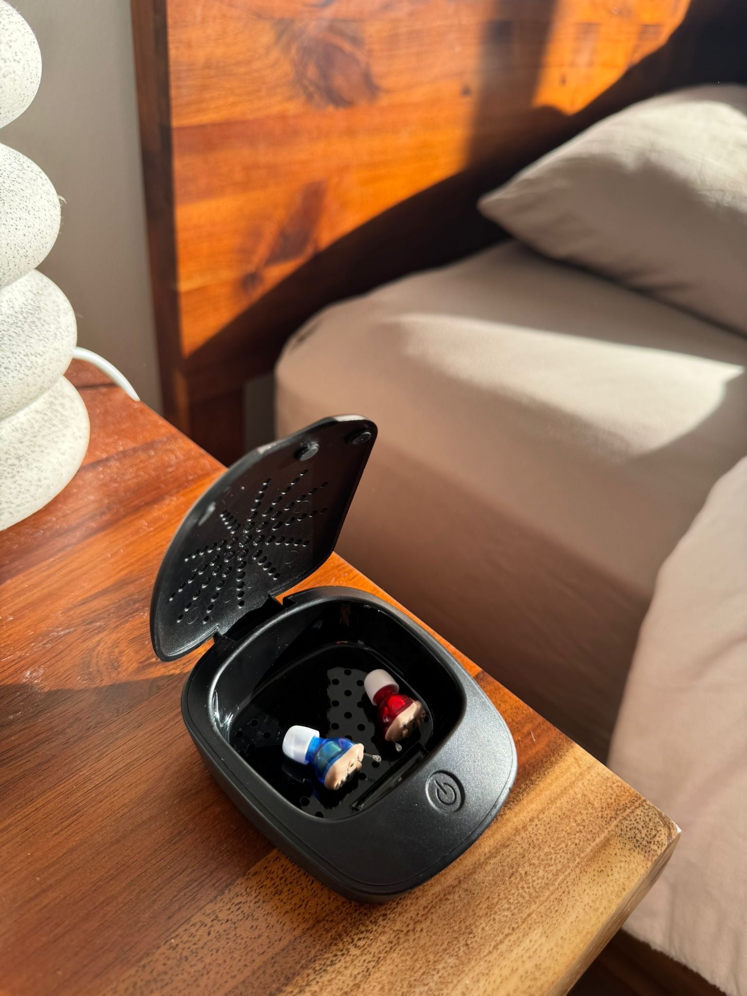 Hearing aid sanitation and dehumidifier